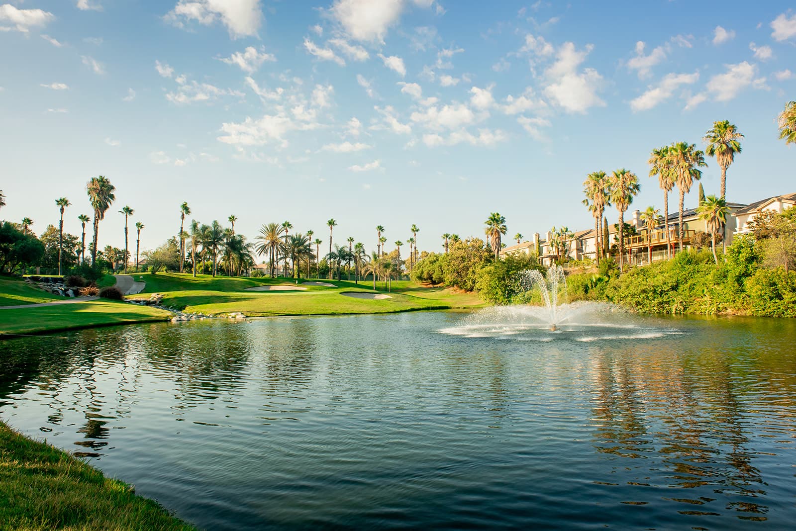 Sierra Lakes Golf Club course photograph, lake and green.