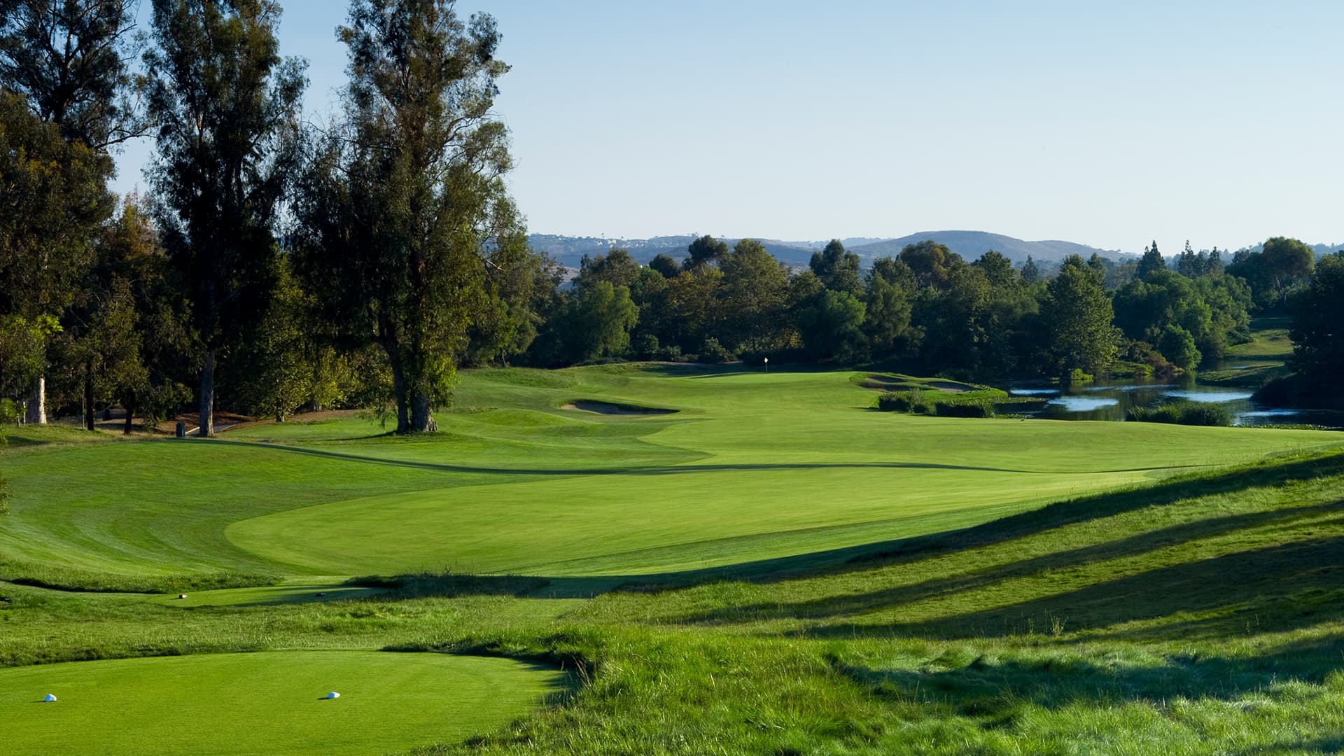 Fairway, trees and water at Oak Creek Golf Club in Irvine.