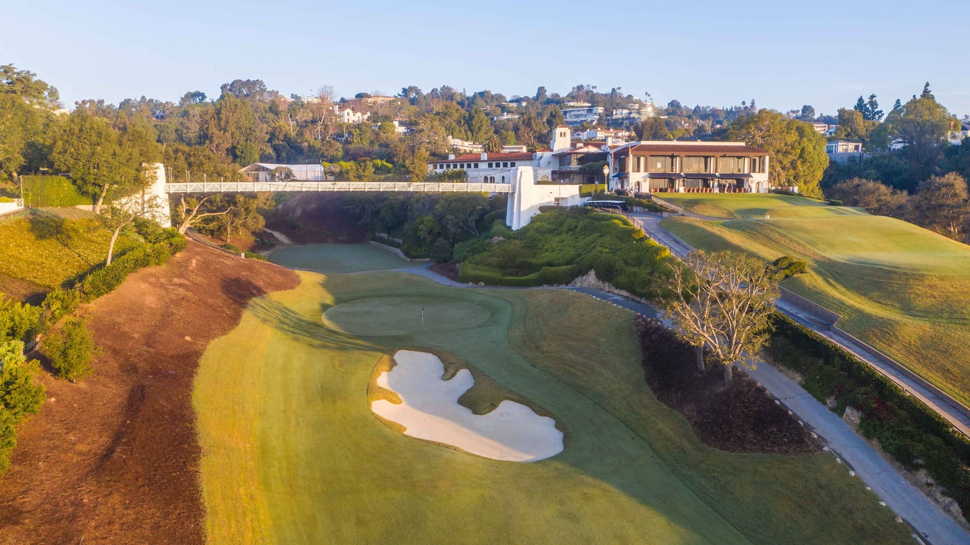 Aerial view of Bel-Air Country Club, Los Angeles, showing the canyon routing. Credit: Patrick "PJ" Koenig / PJKoenig Golf Photography (pjkoenig.com). Used for editorial coverage on a non-commercial site.