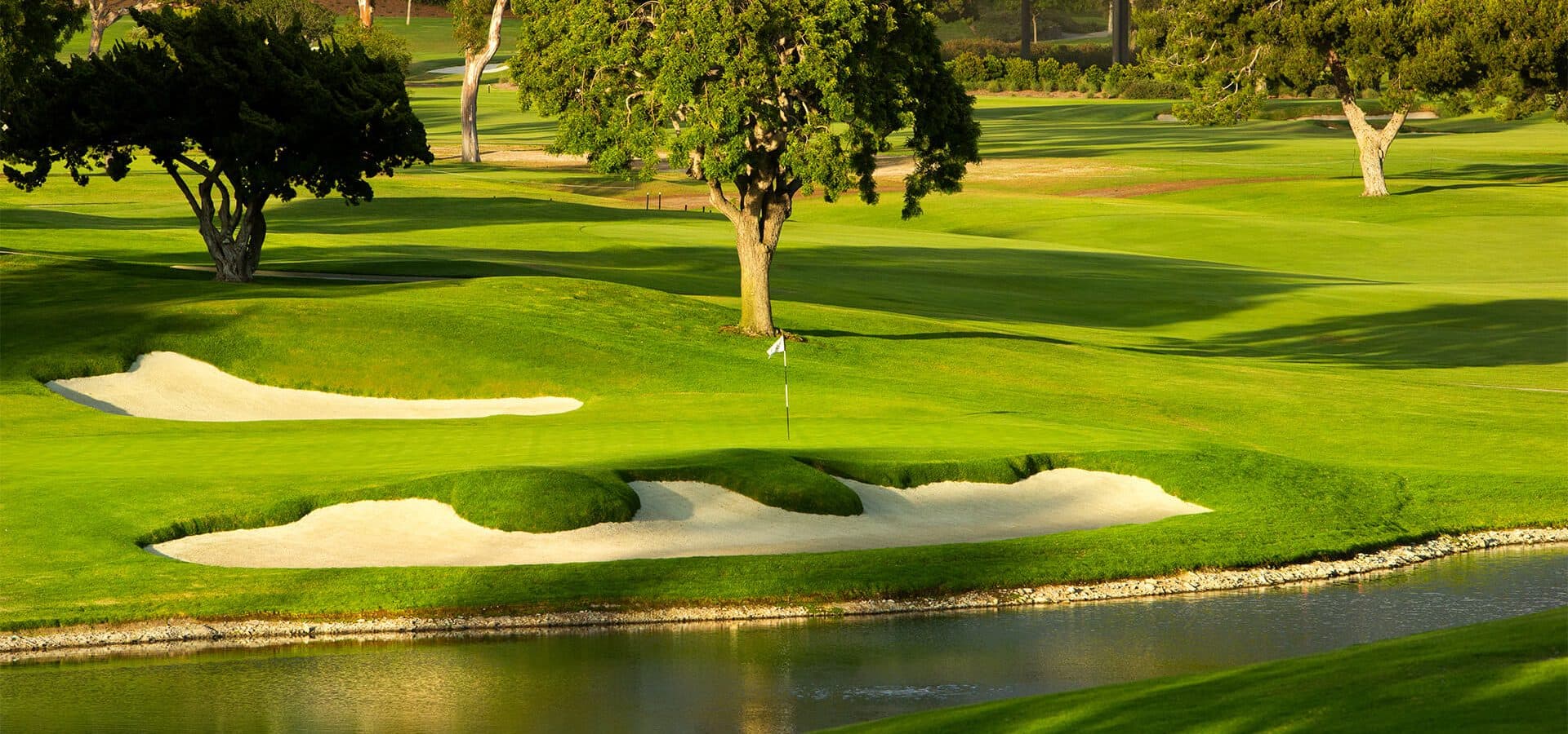 Green, water and bunkers at the renovated Newport Beach Country Club course.