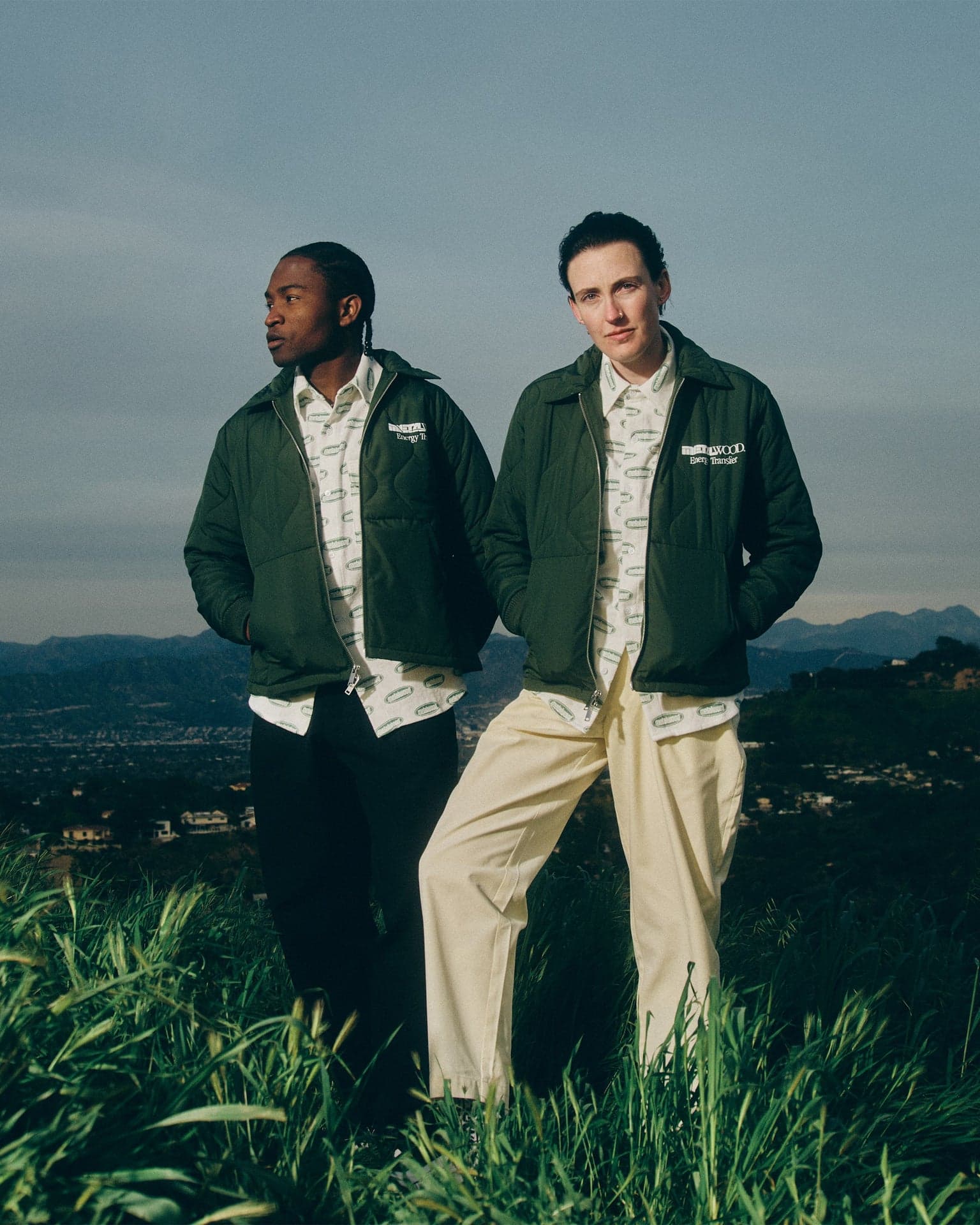Hassan Ayub and Erin Murray wearing Metalwood Studio apparel above Los Angeles. Photo by Ryan Thomas Murray, courtesy of Metalwood Studio, from the official SS23 lookbook: https://metalwood.studio/lookbook/metalwood-studio-ss23-1st-delivery-lookbook