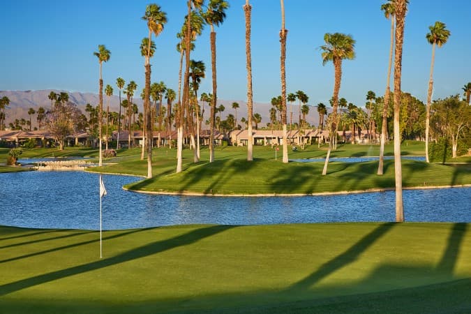 On-course view of Palm Valley Country Club Championship Course: Championship Course: green and lake.