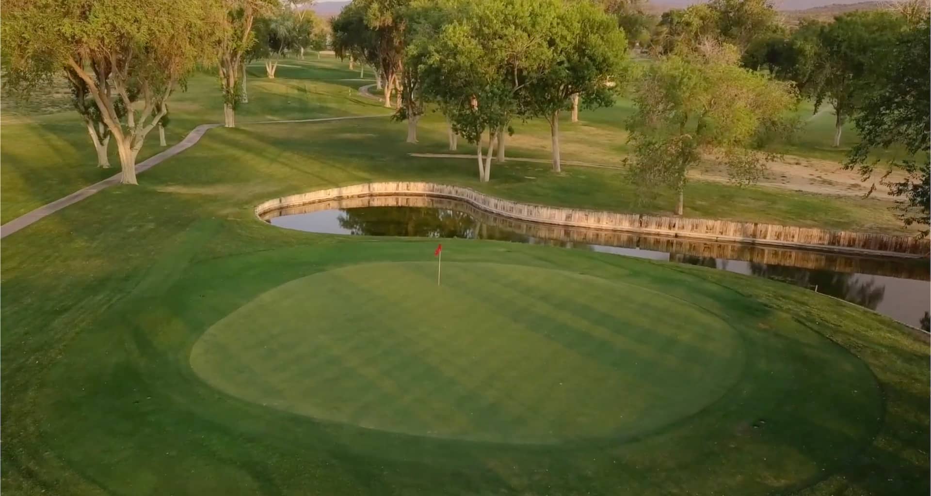 Crystalaire Country Club — pond-side green aerial.