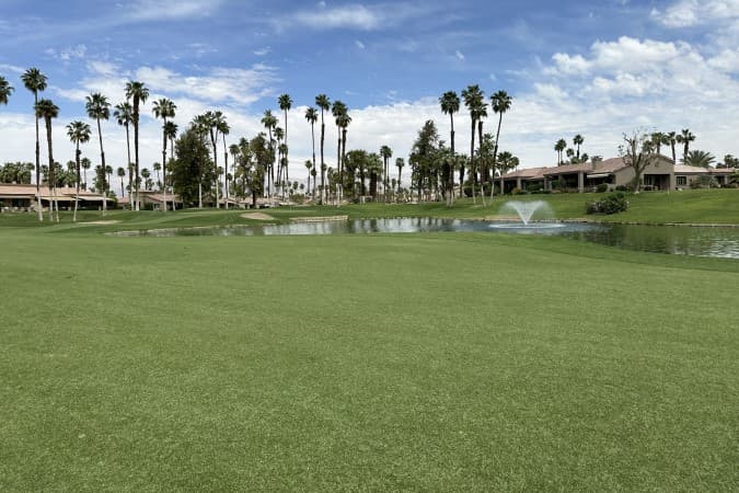 On-course view of Palm Valley Country Club Challenge Course: Challenge Course: fairway and lake.