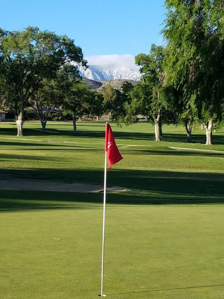 Crystalaire Country Club — green and mountains.