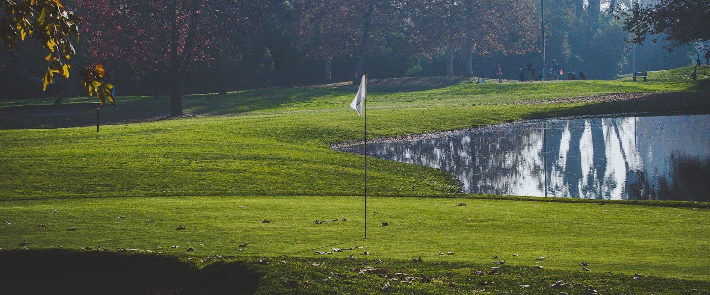 On-course green and water feature at Lake Forest Golf and Practice Center.