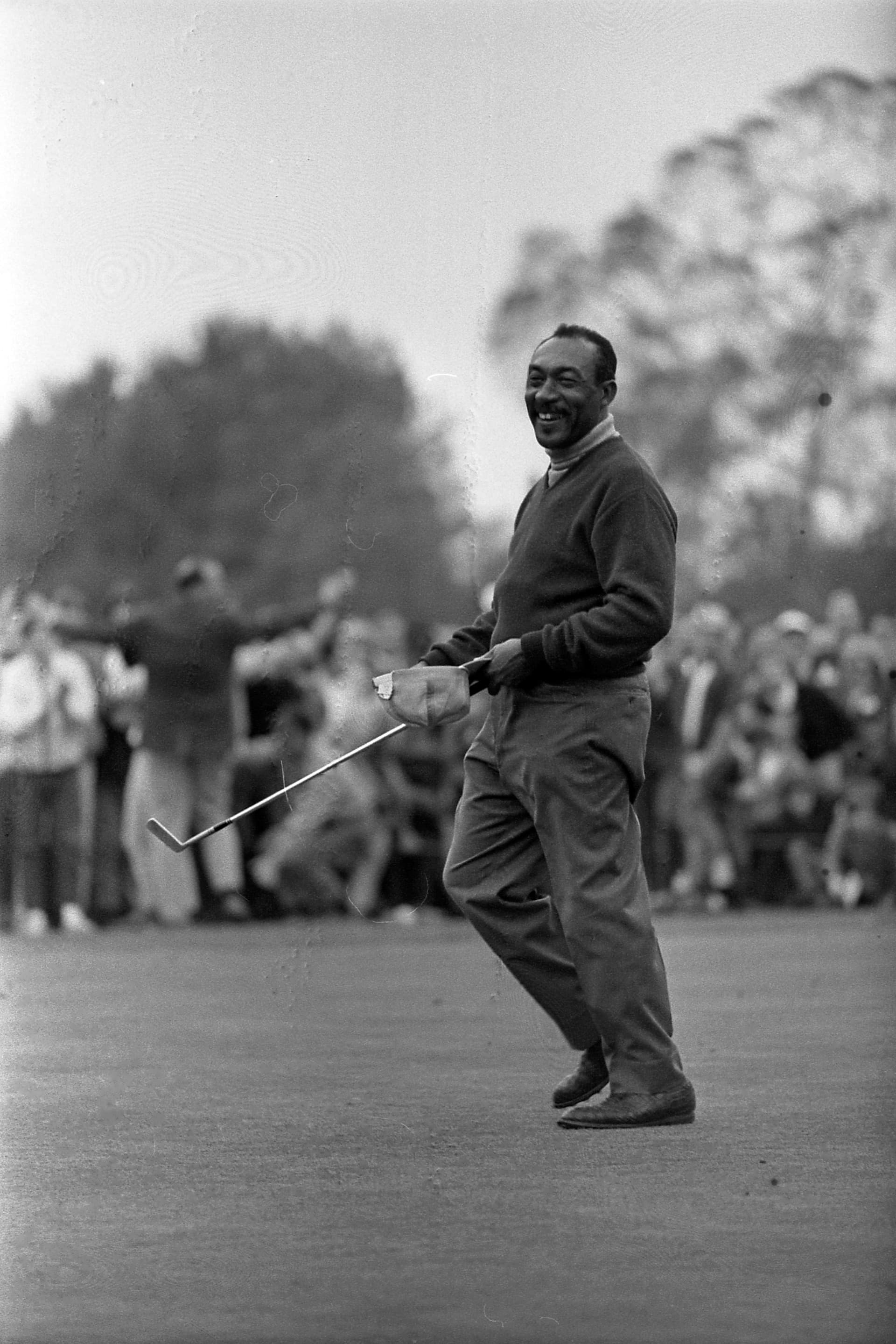 Charlie Sifford celebrates winning the 1969 Los Angeles Open at Rancho Park Golf Course, January 13, 1969. Photo by Ben Olender, Los Angeles Times Photographic Collection, UCLA Library. License: CC BY 4.0, via Wikimedia Commons (https://commons.wikimedia.org/wiki/File:Charlie_Sifford_winning_1969_LA_Open.jpg).